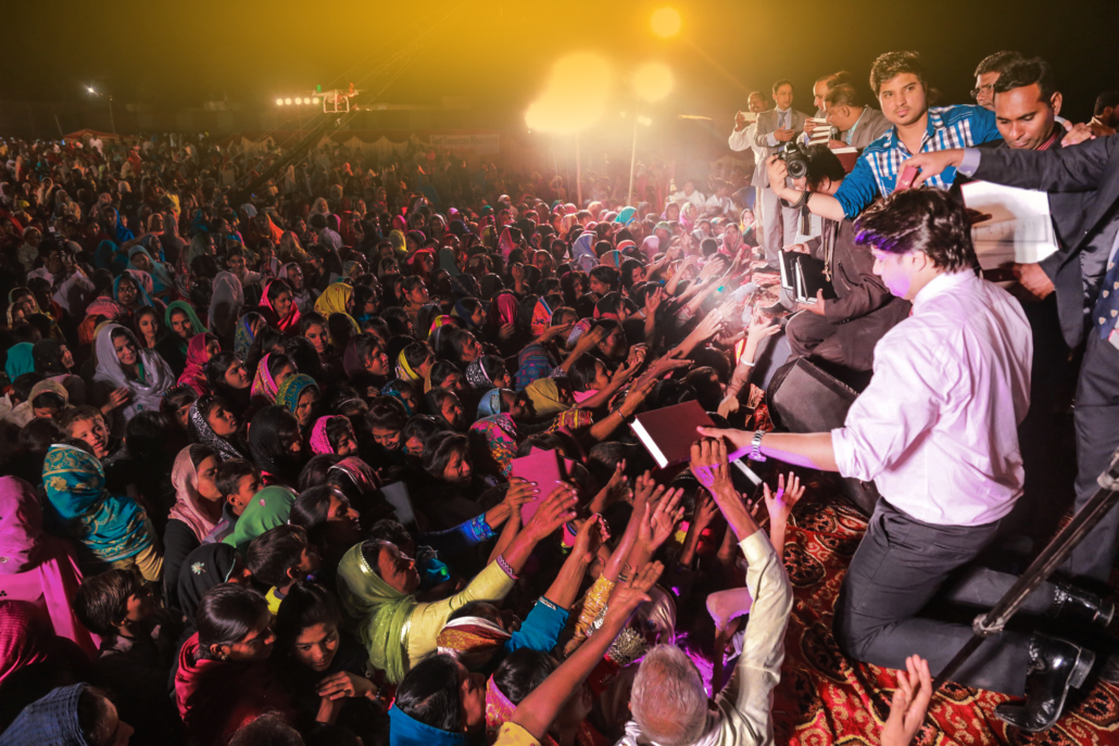 Church Planting in Pakistan through the years: free Urdu Bibles in the crowd